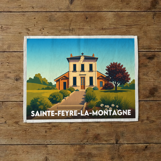 Torchon souvenir de la ville de Sainte-Feyre-la-Montagne avec une illustration stylisée d'un bâtiment historique.