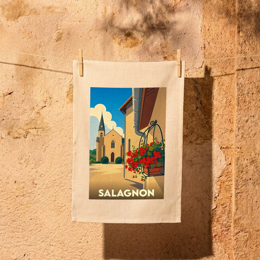 Torchon souvenir de la ville de Salagnon avec une illustration stylisée d'une église et de fleurs.