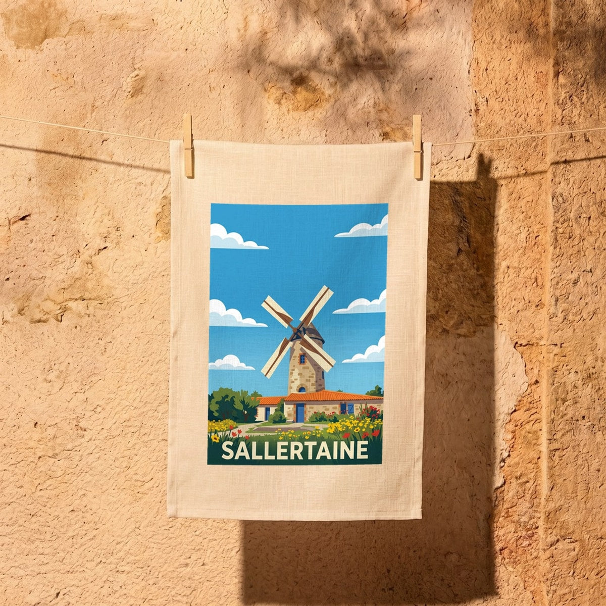 Torchon souvenir de la ville de Sallertaine avec une illustration stylisée de son célèbre moulin à vent.