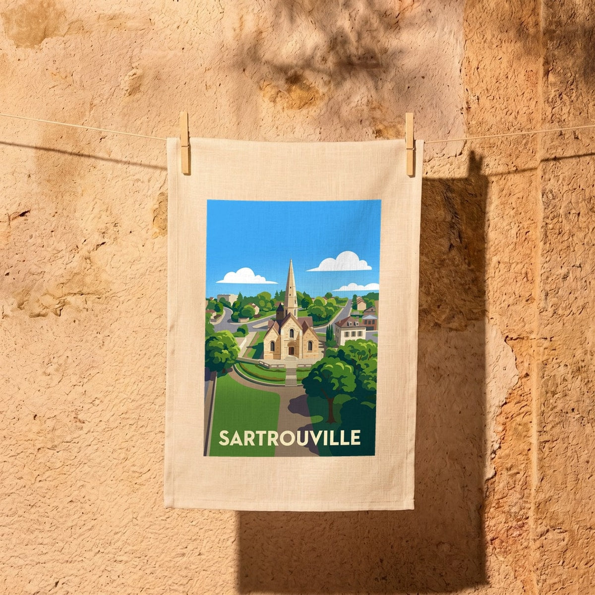 Torchon souvenir de la ville de Sartrouville avec une illustration stylisée.