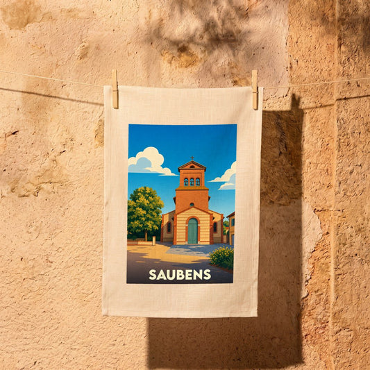 Torchon souvenir de la ville de Saubens avec une illustration stylisée de son église sous un ciel bleu.