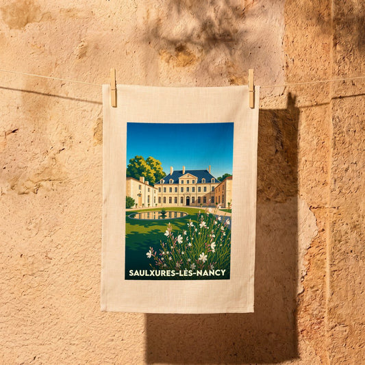Torchon souvenir de la ville de Saulxures-lès-Nancy avec une illustration stylisée d'un château.