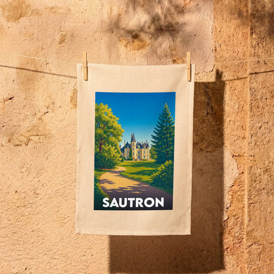 Torchon souvenir de la ville de Sautron avec une illustration stylisée représentant un château dans un parc arboré.