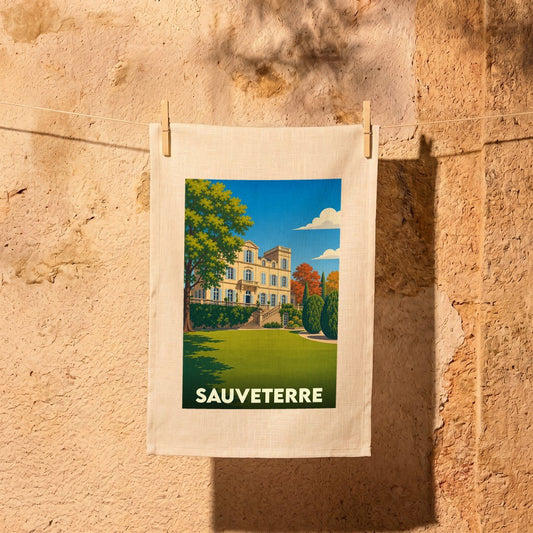 Torchon souvenir de la ville de Sauveterre avec une illustration stylisée d'une bâtisse historique.