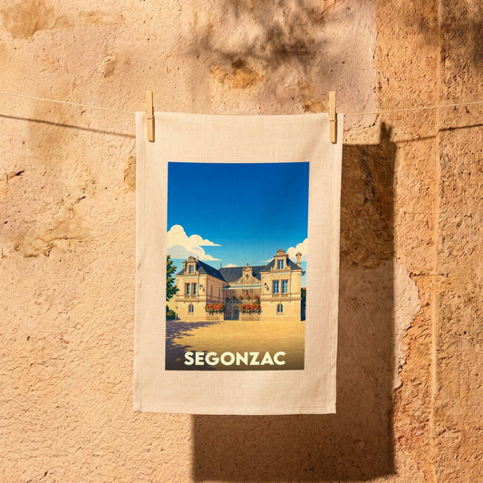 Torchon souvenir de la ville de Segonzac avec une illustration stylisée.