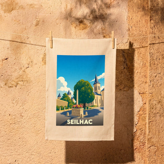 Torchon souvenir de la ville de Seilhac avec une illustration stylisée.