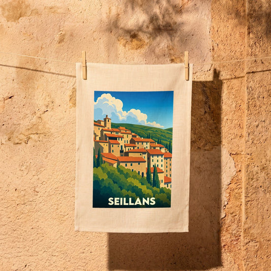 Torchon souvenir de la ville de Seillans avec une illustration stylisée.