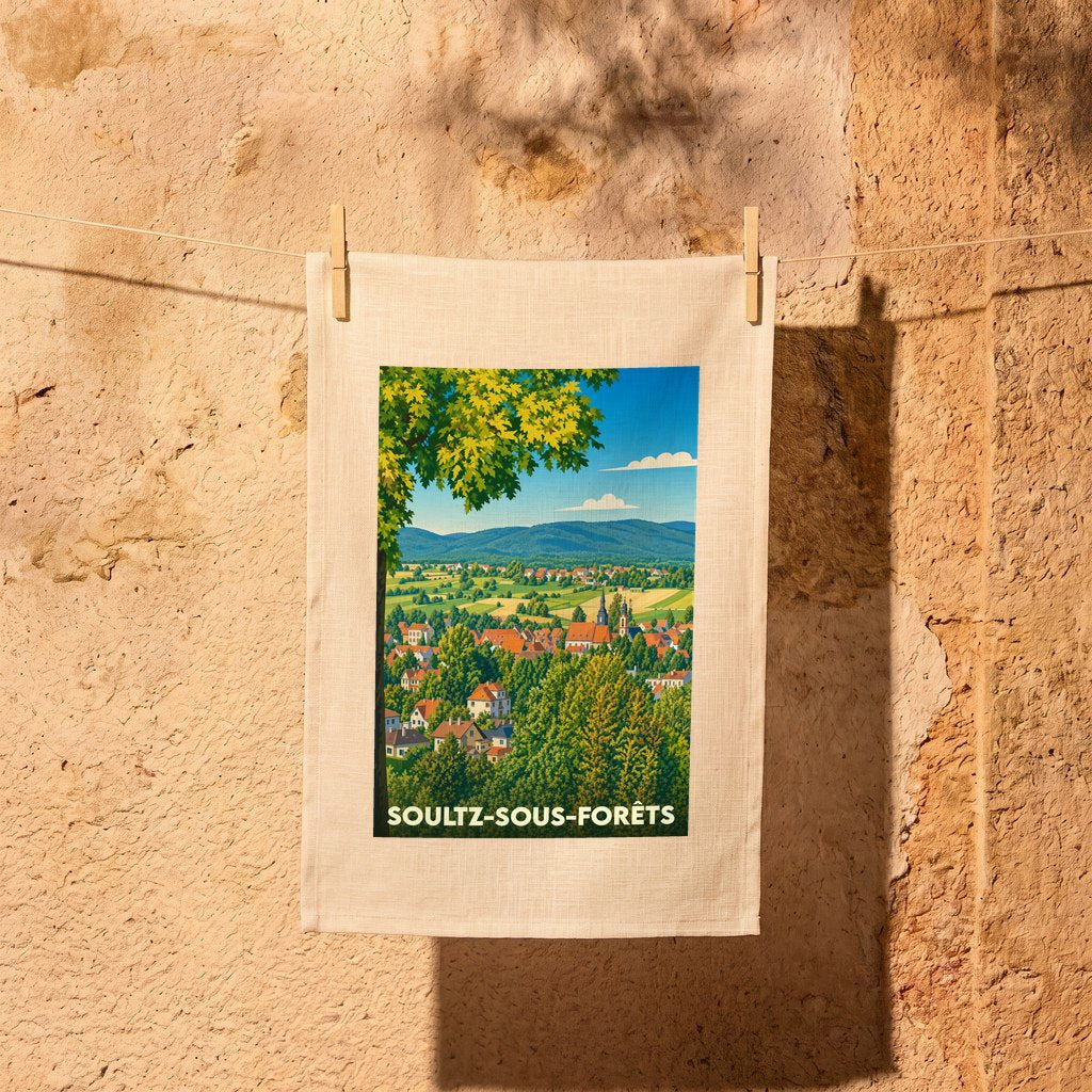 Torchon souvenir de la ville de Soultz-sous-Forêts avec une illustration paysagère stylisée.