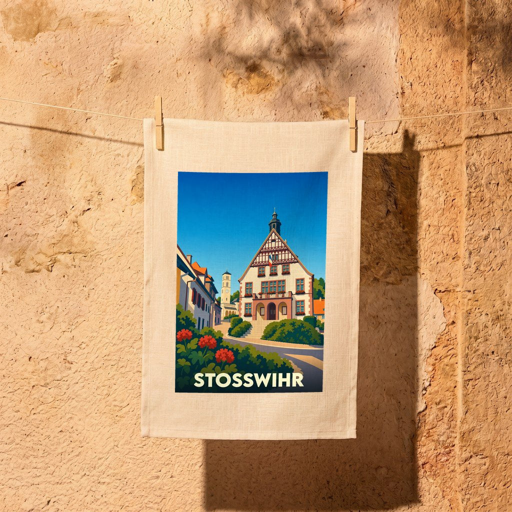 Torchon souvenir de la ville de Stosswihr avec une illustration stylisée d'un bâtiment traditionnel alsacien.