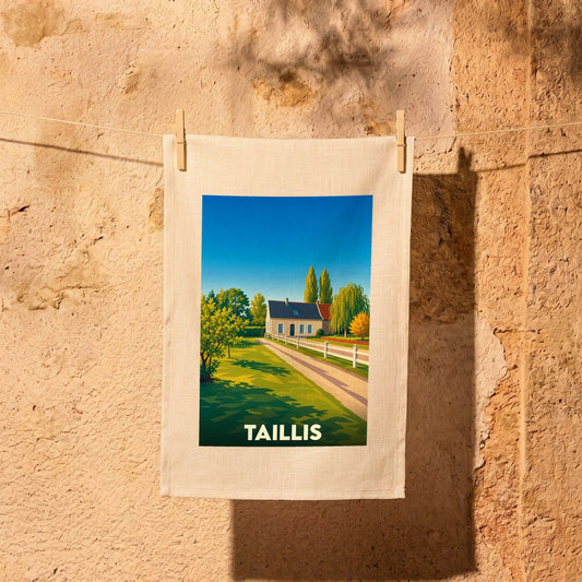 Torchon souvenir de la ville de Taillis avec une illustration stylisée d'une maison de campagne.