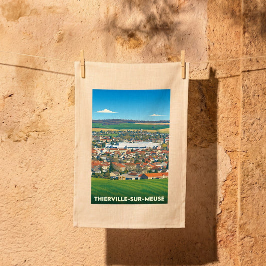 Torchon souvenir de la ville de Thierville-sur-Meuse orné d'une illustration paysagère stylisée.