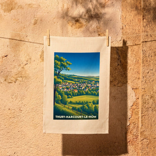 Torchon souvenir de la ville de Thury-Harcourt-le-Hom avec une illustration stylisée.