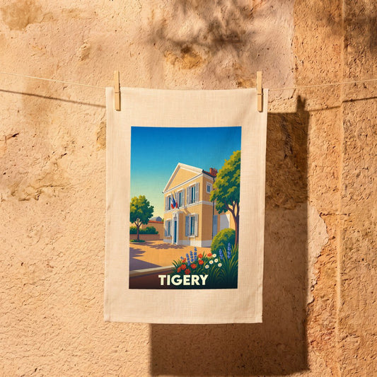 Torchon souvenir de la ville de Tigery avec une illustration stylisée d'une maison de maître sous un ciel bleu.