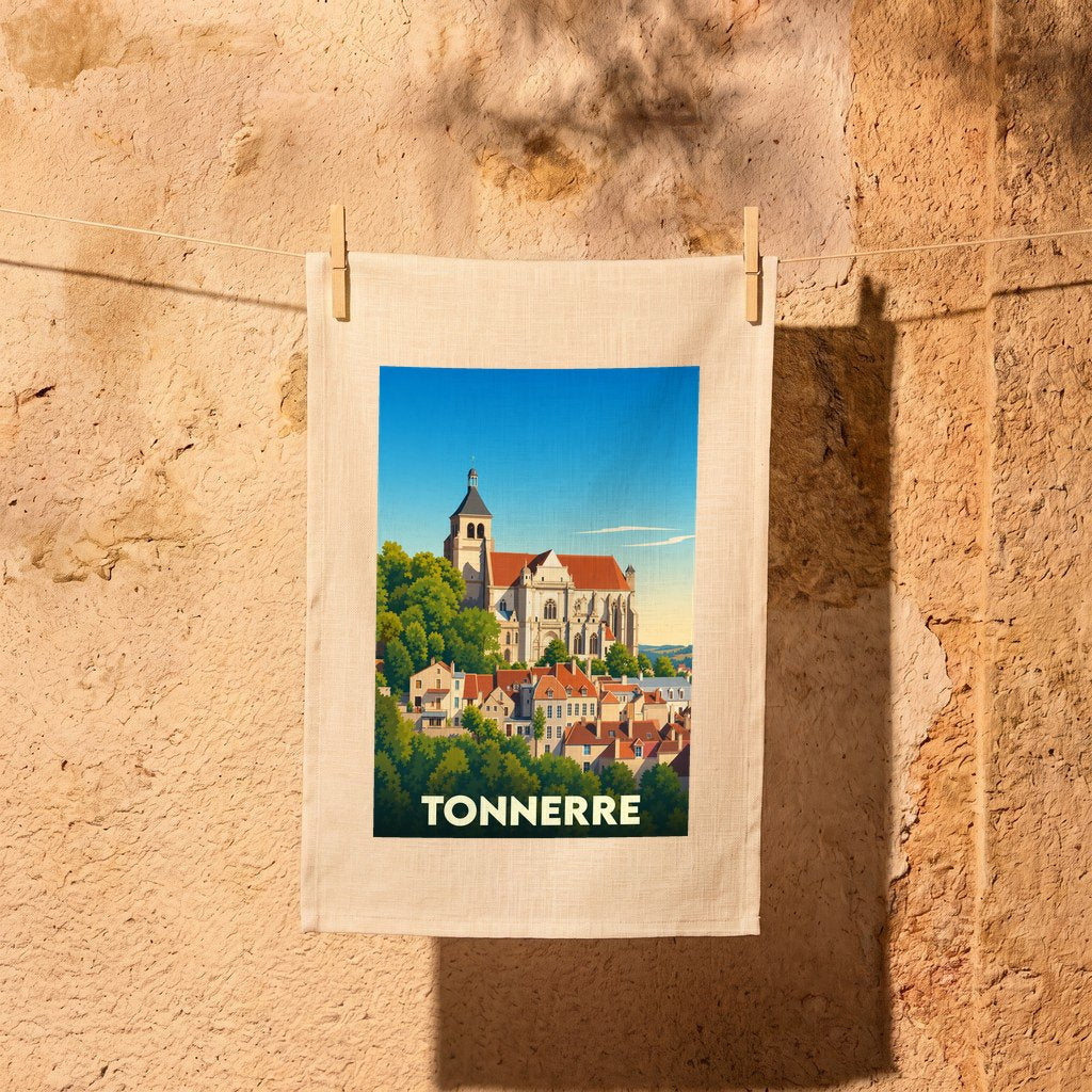 Torchon souvenir de la ville de Tonnerre avec une illustration stylisée d'une église surplombant des maisons.