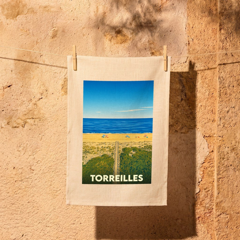 Torchon souvenir de la ville de Torreilles avec une illustration stylisée de sa plage et de ses dunes.