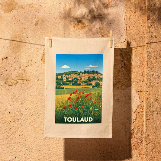 Torchon souvenir de la ville de Toulaud illustré d'un paysage champêtre aux coquelicots.