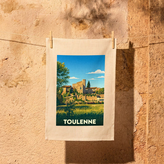Torchon souvenir de la ville de Toulenne avec une illustration stylisée.