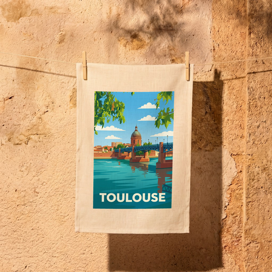 Torchon souvenir de la ville de Toulouse avec une illustration stylisée du pont Saint-Pierre et du dôme de La Grave.