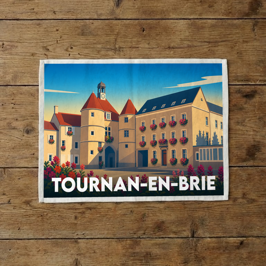 Torchon souvenir de la ville de Tournan-en-Brie avec une illustration stylisée de son architecture.