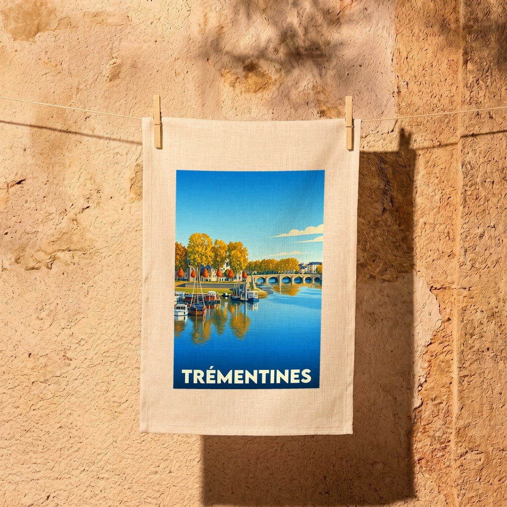 Torchon souvenir de la ville de Trémentines avec une illustration stylisée d'un paysage fluvial.