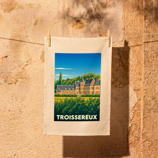 Torchon souvenir de la ville de Troissereux avec une illustration stylisée de son château.