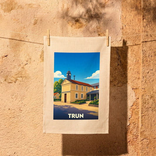 Torchon souvenir de la ville de Trun orné d'une illustration stylisée de son architecture.