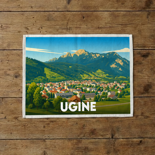 Torchon souvenir de la ville d'Ugine illustré par un paysage de montagne stylisé.