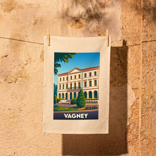 Torchon souvenir de la ville de Vagney avec une illustration stylisée de son architecture.