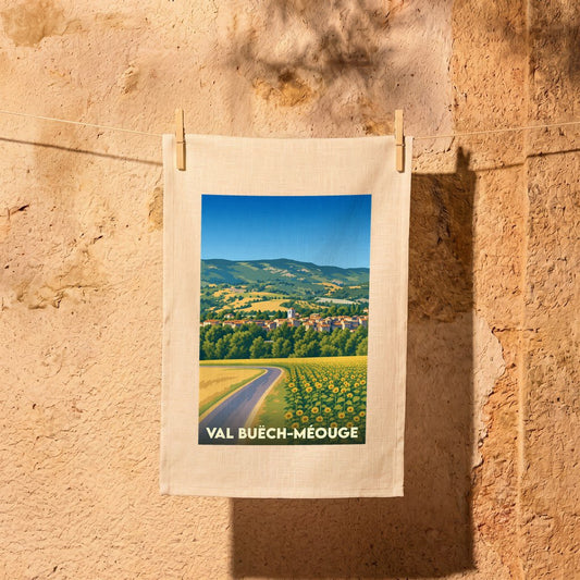 Torchon souvenir de la ville de Val Buëch-Méouge avec une illustration stylisée de paysages provençaux.