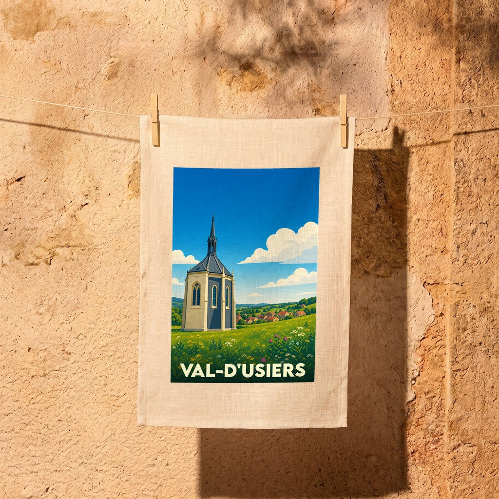 Torchon souvenir de la ville de Val-d'Usiers avec une illustration stylisée d'une chapelle dans un paysage verdoyant.