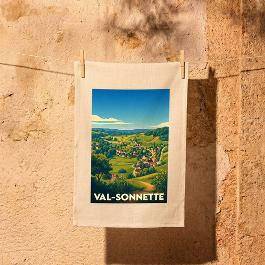 Torchon souvenir de la ville de Val-Sonnette illustré d'un paysage de campagne vallonné.