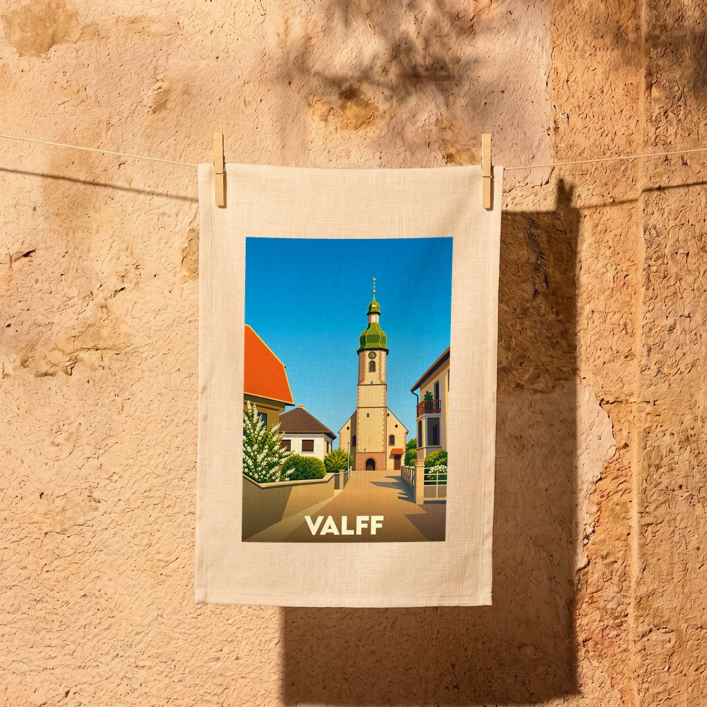 Torchon souvenir de la ville de Valff avec une illustration stylisée de son église et de ses maisons alsaciennes.