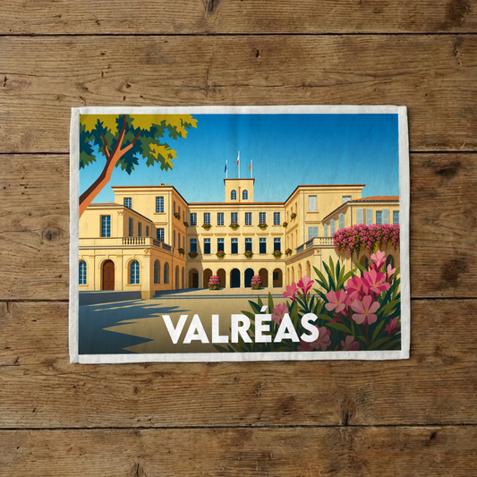 Torchon souvenir de la ville de Valréas illustrant son château historique dans un style graphique et coloré.