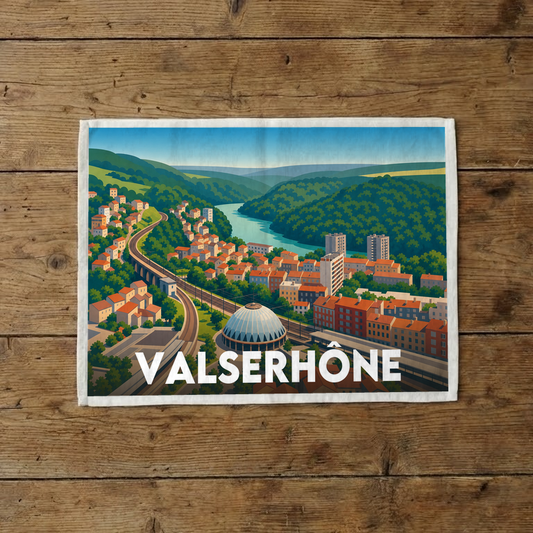 Torchon souvenir de la ville de Valserhône avec une illustration stylisée de son paysage.