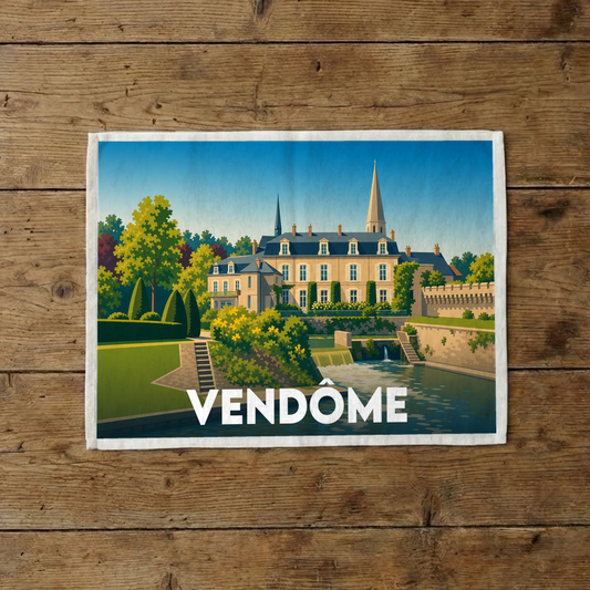 Torchon souvenir de la ville de Vendôme avec une illustration stylisée d'un château au bord de l'eau.