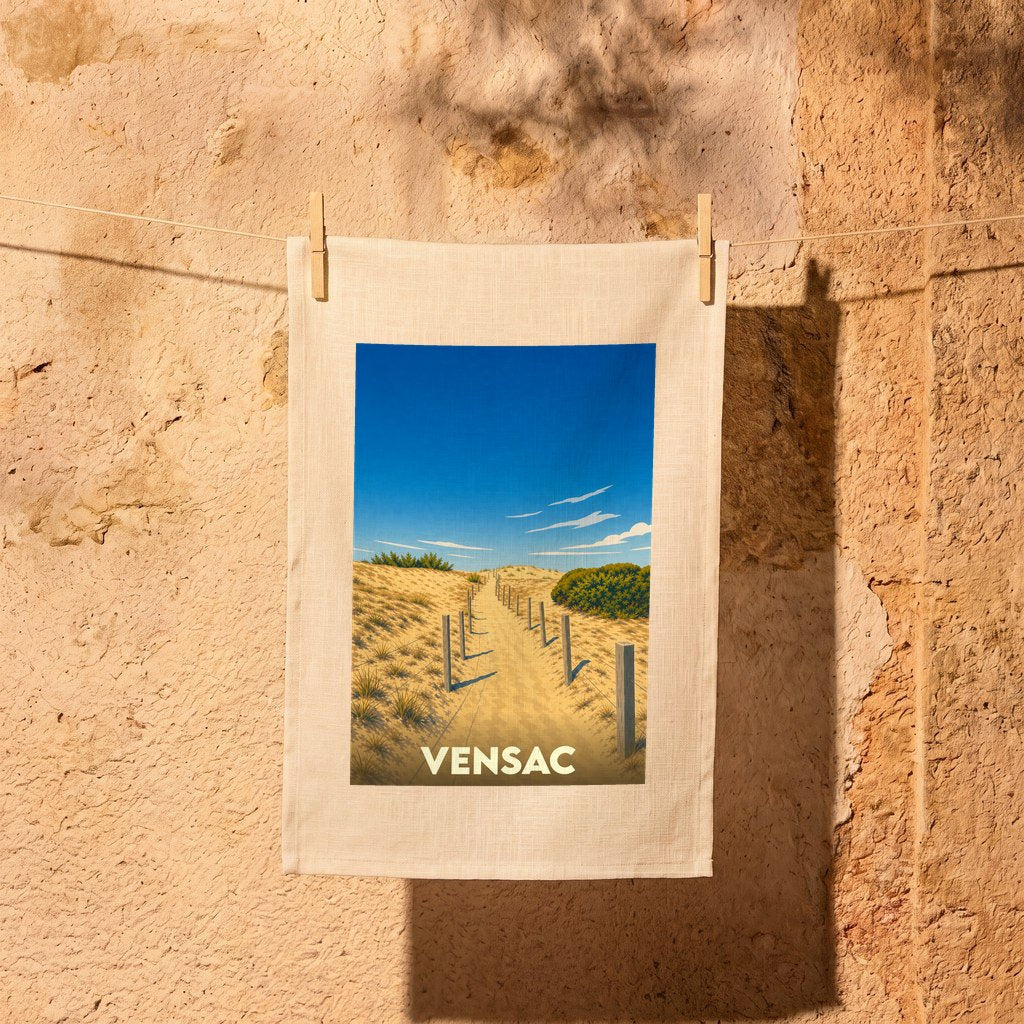Torchon souvenir de la ville de Vensac avec une illustration stylisée d'un chemin à travers les dunes.