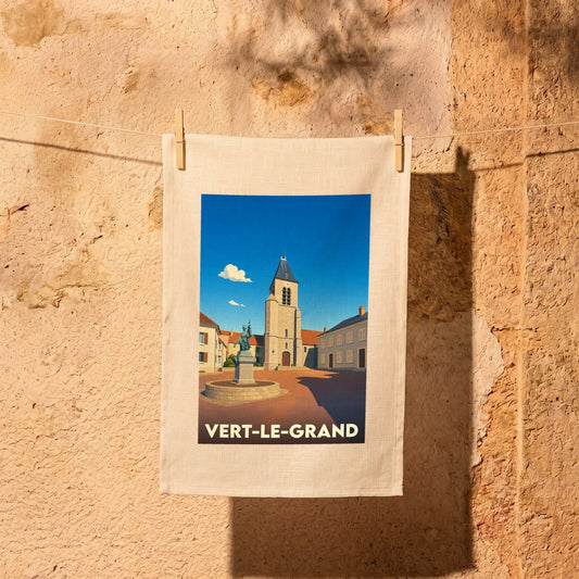 Torchon souvenir de la ville de Vert-le-Grand avec une illustration stylisée de sa place et de son église.