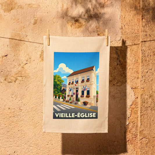 Torchon souvenir de la ville de Vieille-Église avec une illustration stylisée.