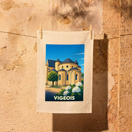 Torchon souvenir de la ville de Vigeois avec une illustration stylisée de son église abbatiale.