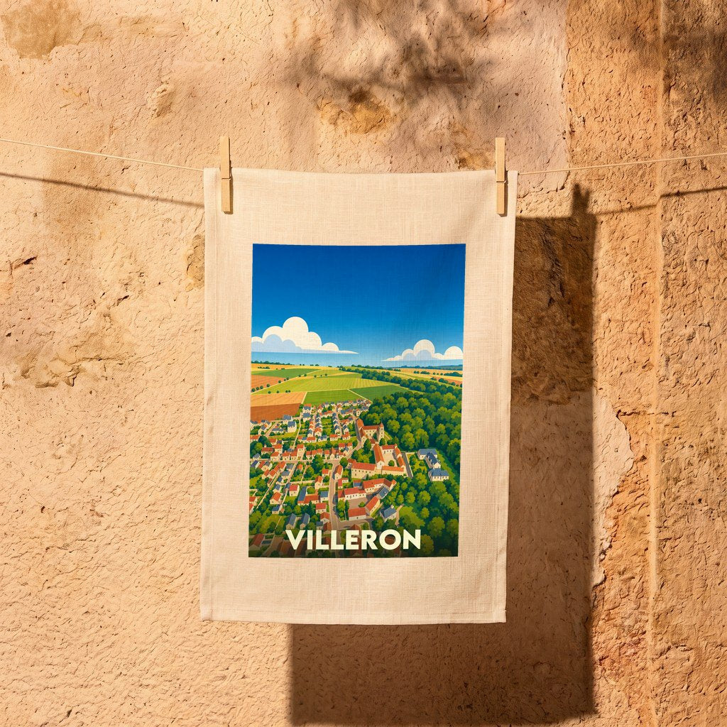 Torchon souvenir de la ville de Villeron avec une illustration stylisée d'un paysage de campagne.