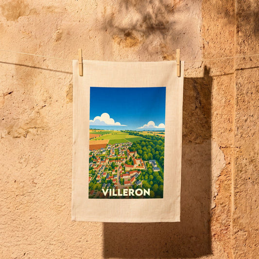 Torchon souvenir de la ville de Villeron avec une illustration stylisée d'un paysage de campagne.