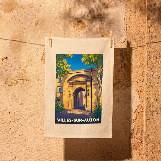 Torchon souvenir de la ville de Villes-sur-Auzon avec une illustration stylisée d'un porche en pierre.