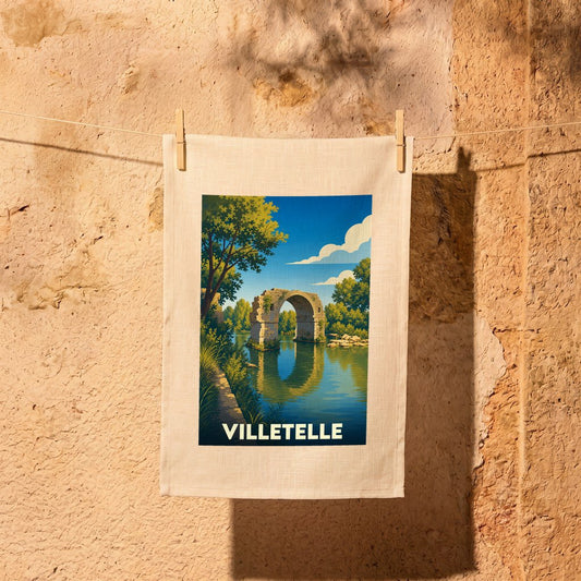 Torchon souvenir de la ville de Villetelle avec une illustration stylisée du pont romain.
