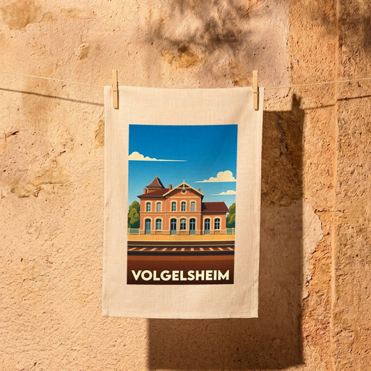 Torchon souvenir de la ville de Volgelsheim avec une illustration stylisée de sa gare ferroviaire.