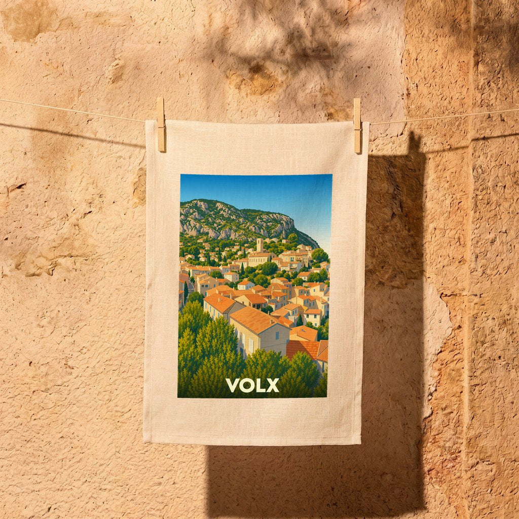 Torchon souvenir de la ville de Volx avec une illustration stylisée.