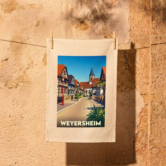 Torchon souvenir de la ville de Weyersheim avec une illustration stylisée de ses maisons à colombages.