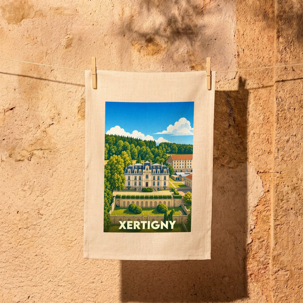 Torchon souvenir de la ville de Xertigny avec une illustration stylisée de son château.