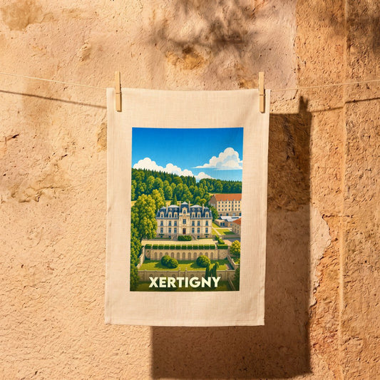 Torchon souvenir de la ville de Xertigny avec une illustration stylisée de son château.