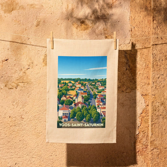 Torchon souvenir de la ville de Ygos-Saint-Saturnin avec une illustration stylisée.