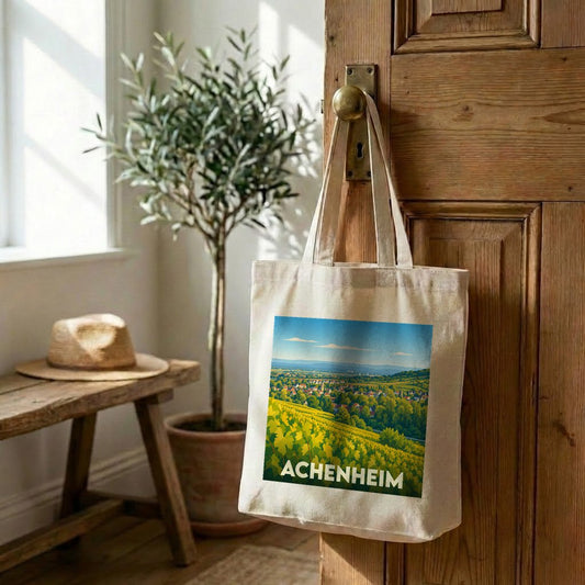 Tote bag souvenir de la ville d'Achenheim avec une illustration stylisée de ses vignobles.